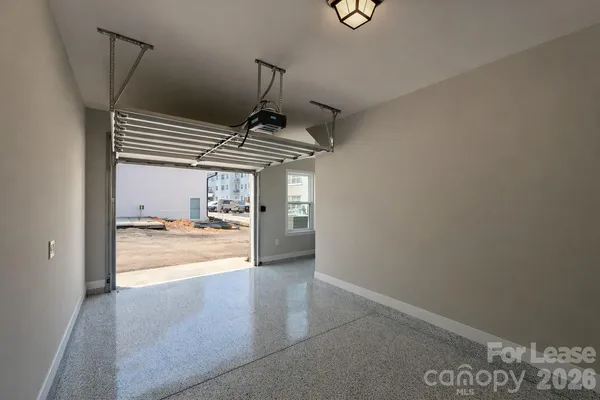 a bathroom with a granite countertop bathtub shower sink vanity and toilet