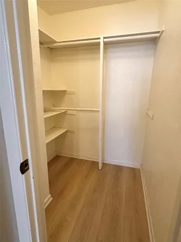 a view of an empty walk in closet