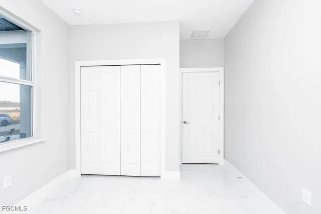 a bathroom with a sink vanity mirror and toilet