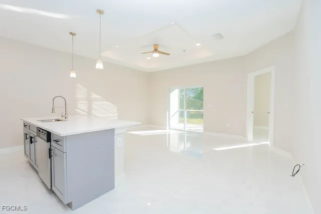 a view of a kitchen with a sink and a window