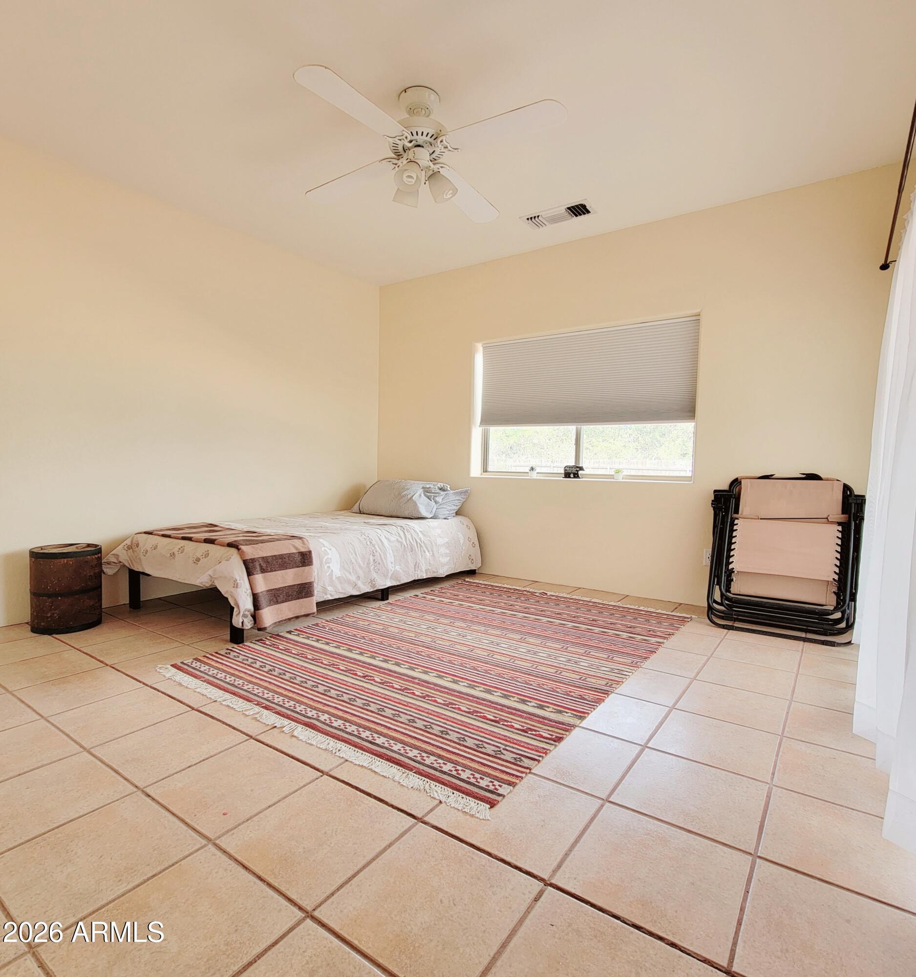 5665 North Vicki Lane Rimrock, AZ 86335 - Photo 12 of 27 a bedroom with a bed and a window