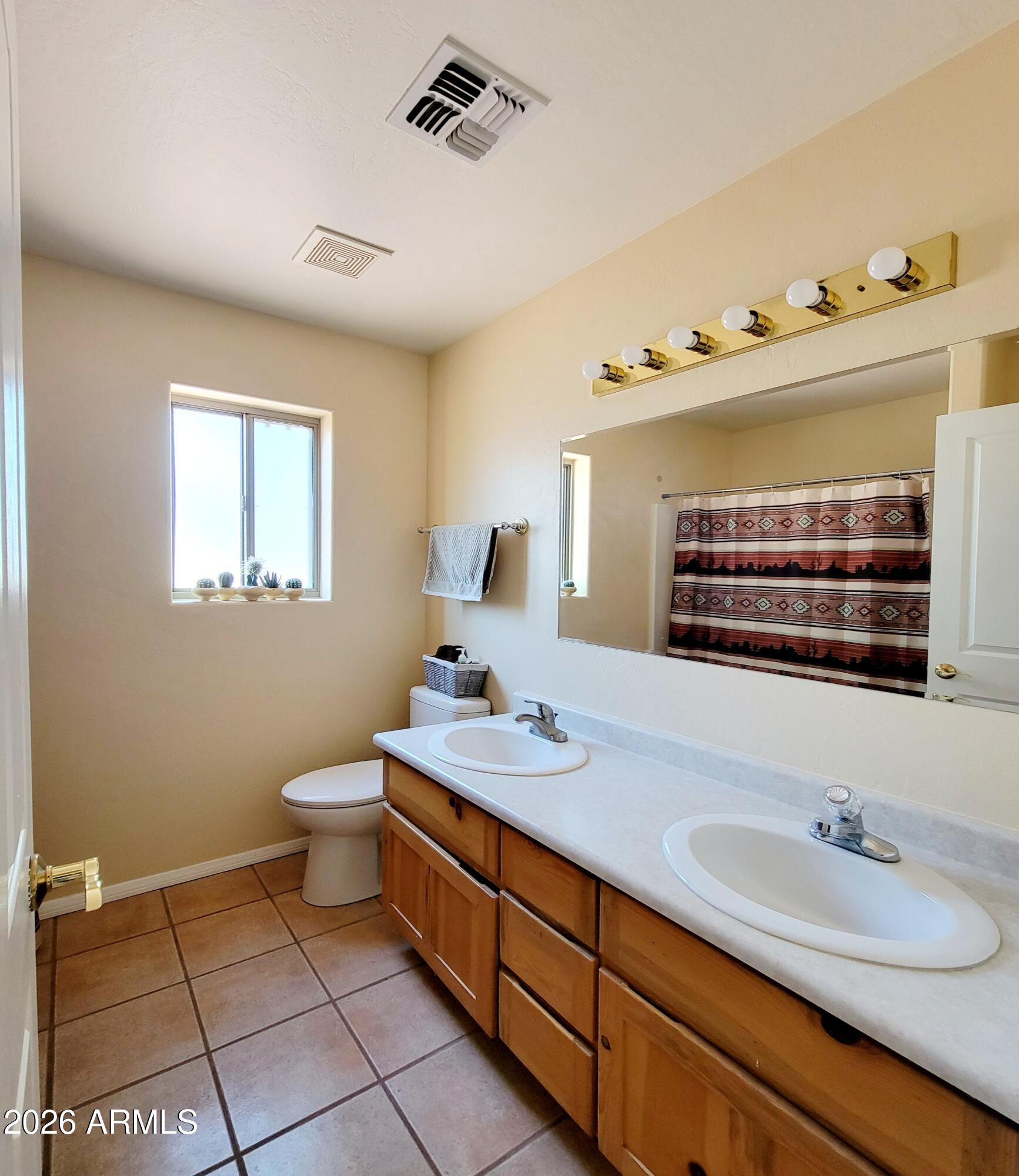 5665 North Vicki Lane Rimrock, AZ 86335 - Photo 13 of 27 a bathroom with a sink and a mirror
