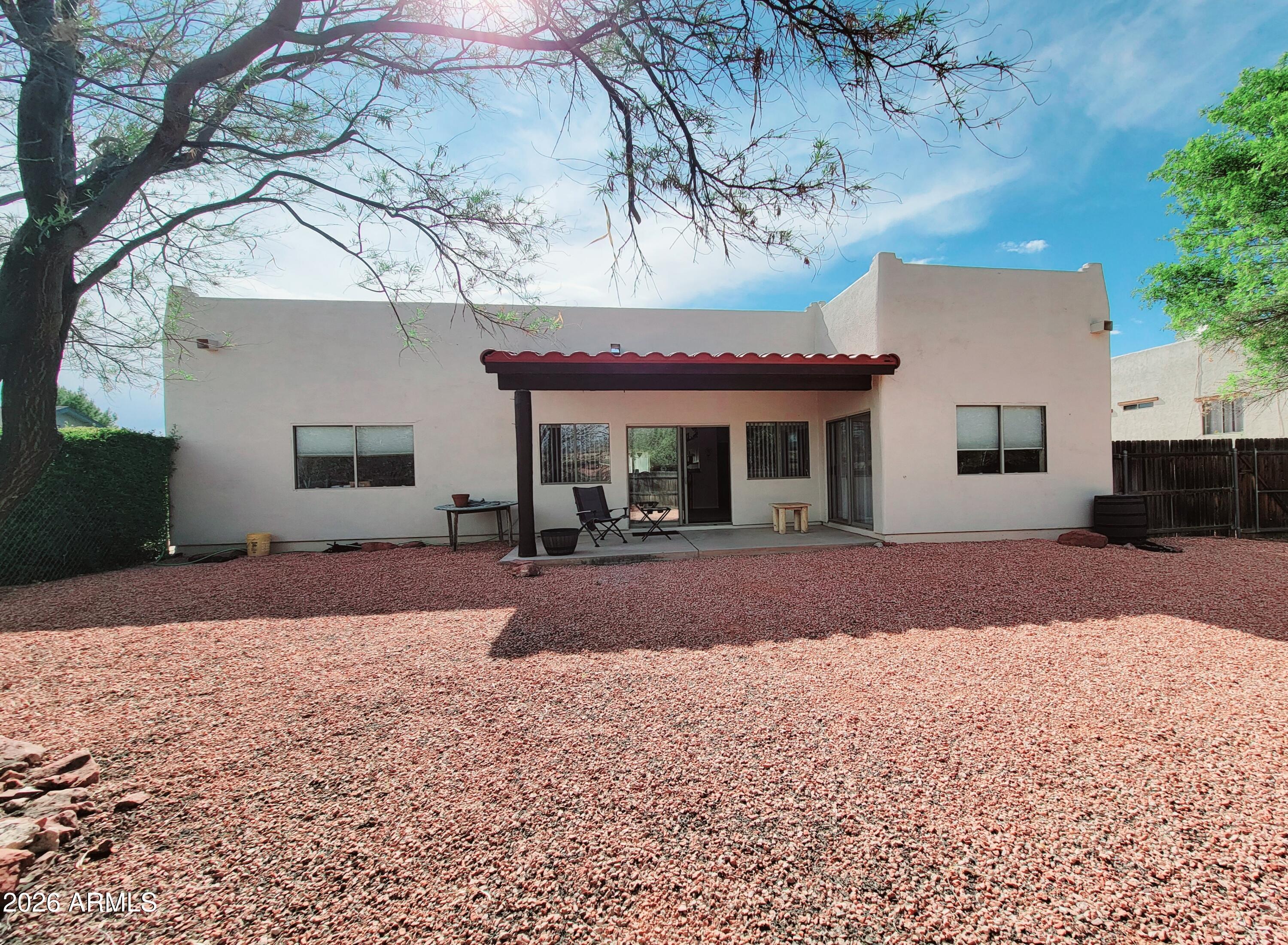 5665 North Vicki Lane Rimrock, AZ 86335 - Photo 22 of 27 a front view of a house with a yard and a garage