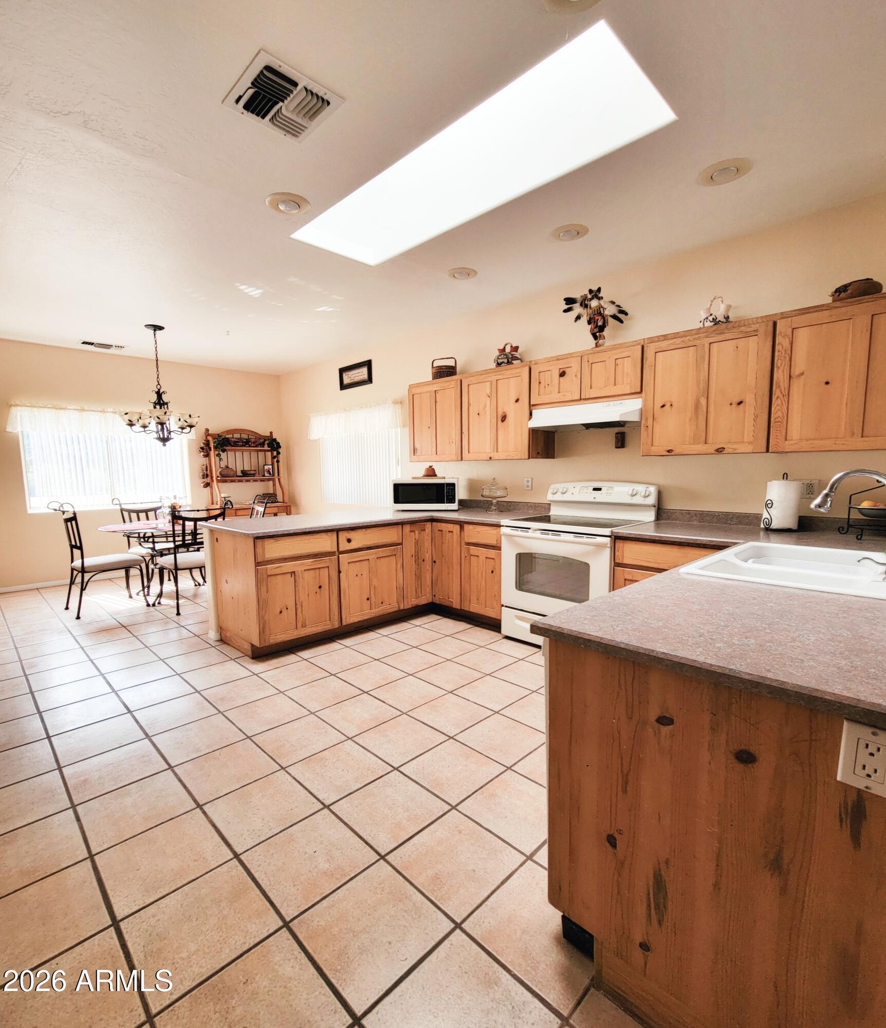 5665 North Vicki Lane Rimrock, AZ 86335 - Photo 5 of 27 a kitchen with stainless steel appliances granite countertop a sink and cabinets