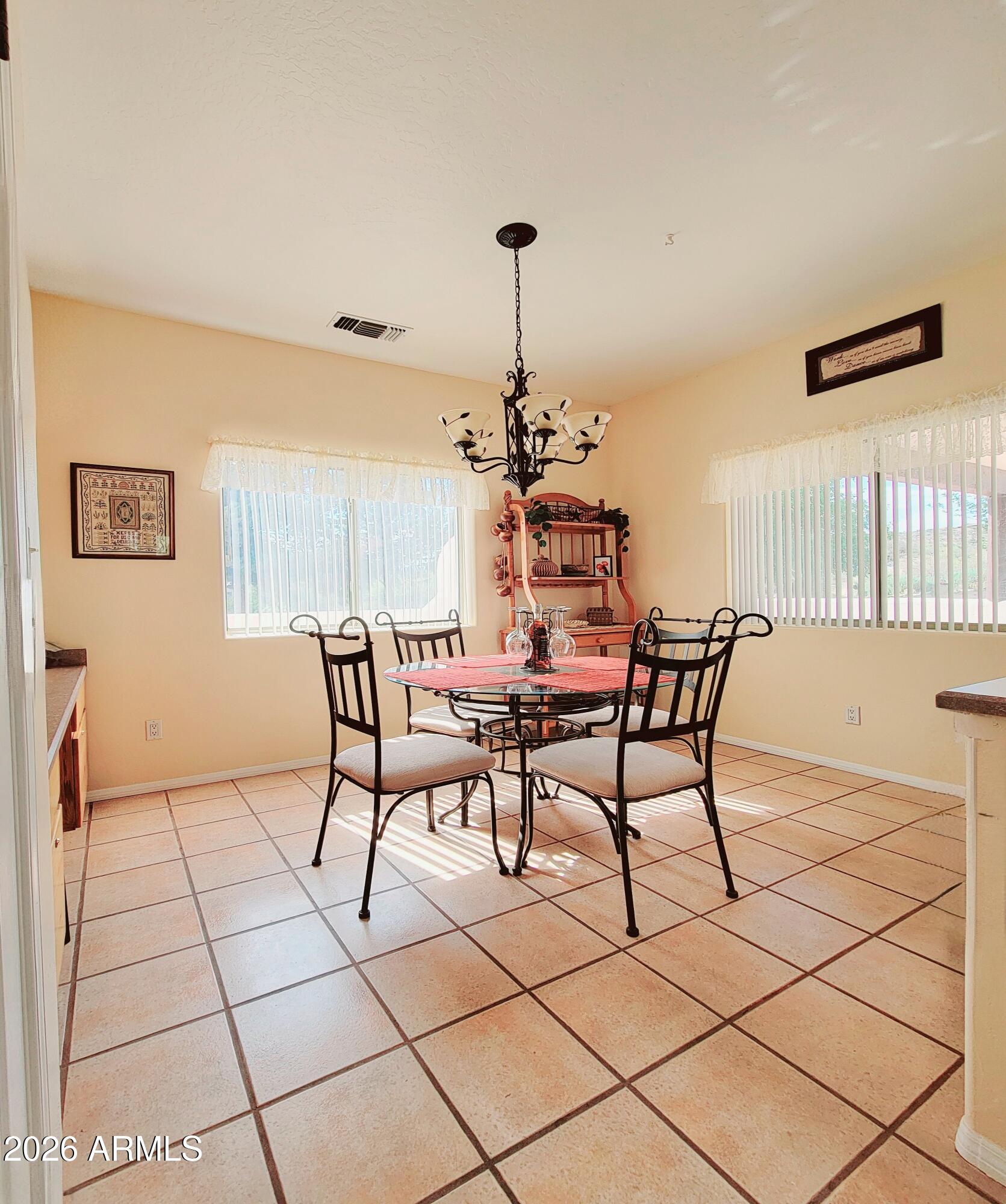 5665 North Vicki Lane Rimrock, AZ 86335 - Photo 8 of 27 a dining room with furniture and a chandelier