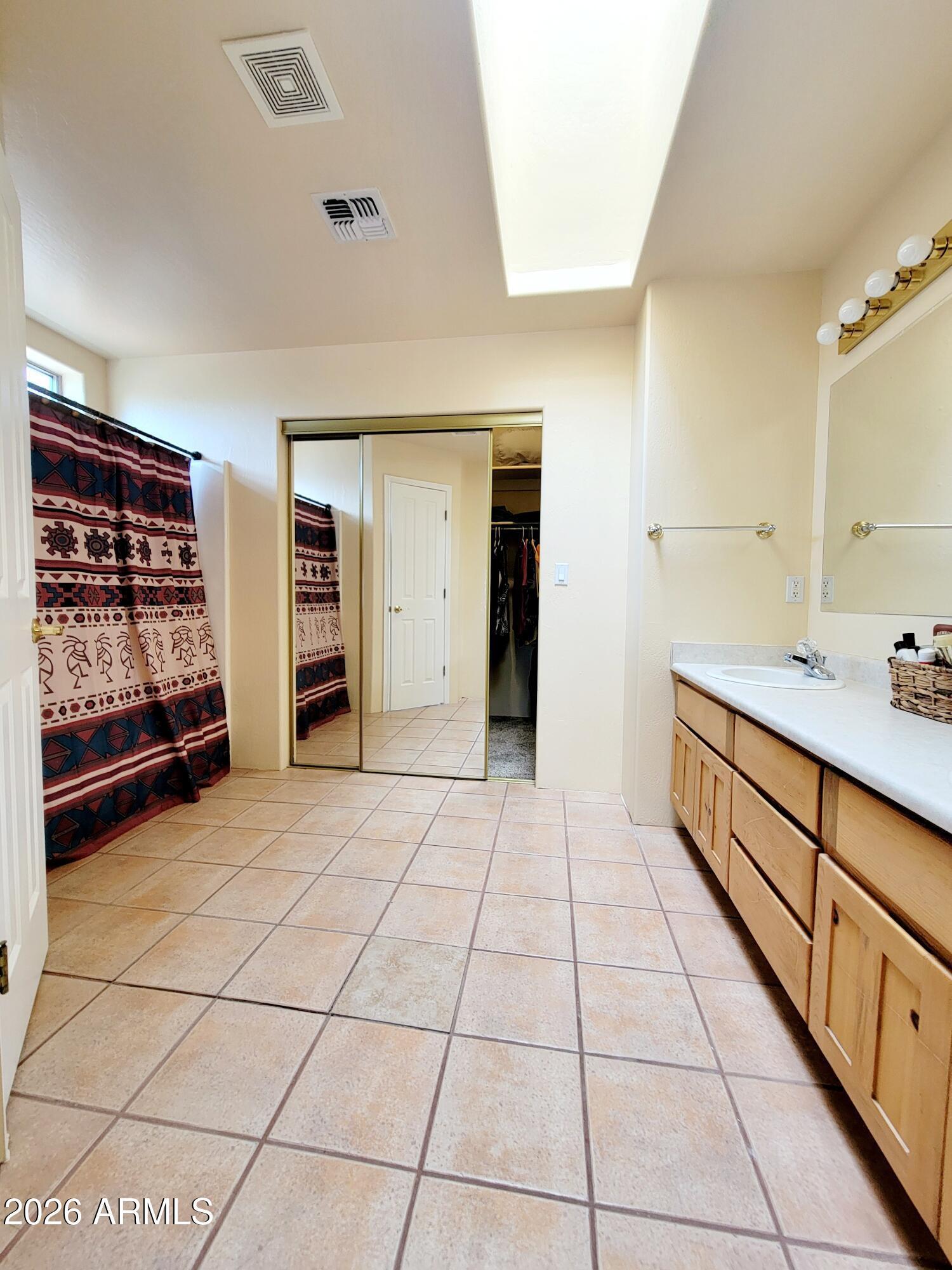 5665 North Vicki Lane Rimrock, AZ 86335 - Photo 10 of 27 a bathroom with a sink and a mirror