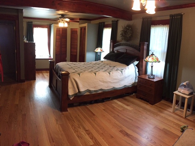 172 South Delany Road Gurnee, IL 60031 - Photo 7 of 13 a bedroom with a bed lamp on desk and a window