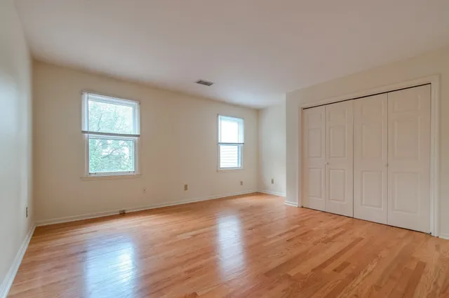 a bathroom with a granite countertop toilet and a bathtub