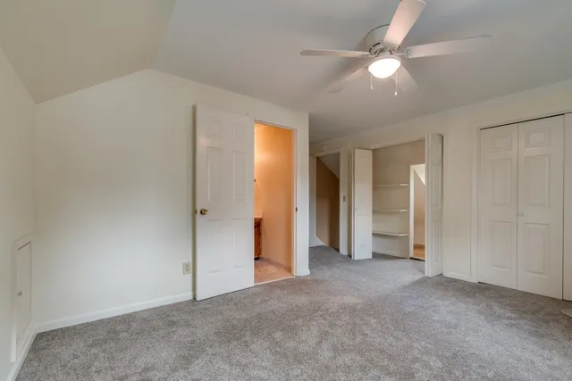 a view of a room with window and stairs