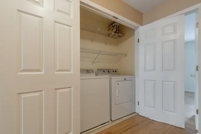 a view of balcony with wooden floor and fence