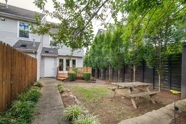 a view of a backyard with sitting area