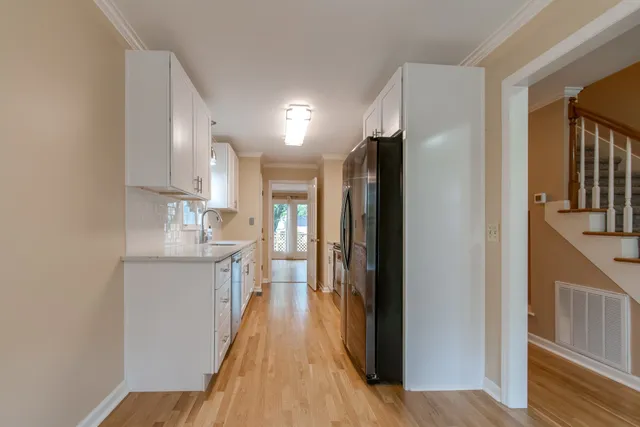 a view of a kitchen from the hallway