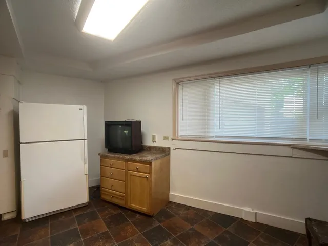 a kitchen with a appliances cabinets and a counter top