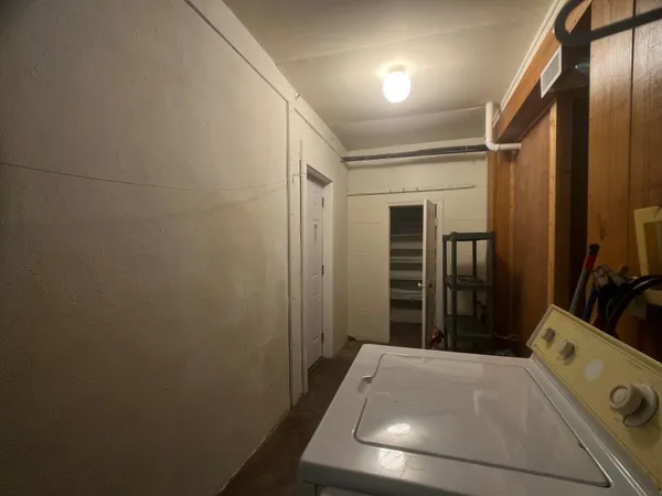 a room with bed and furniture