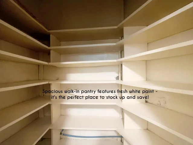 a view of a kitchen with an empty shelf