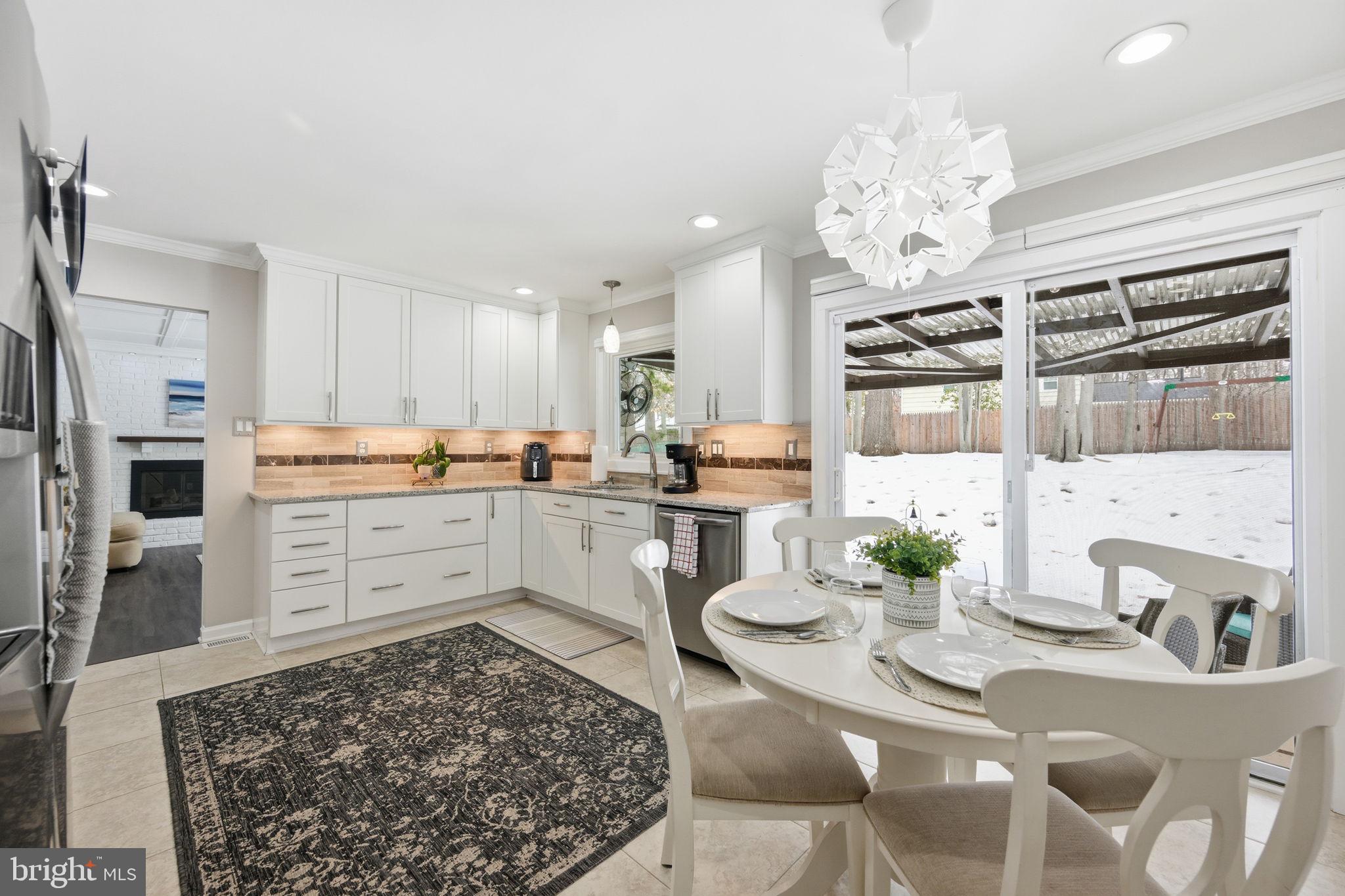 1708 Tarleton Way Crofton, MD 21114 - Photo 14 of 38 a kitchen with stainless steel appliances granite countertop a sink stove and refrigerator