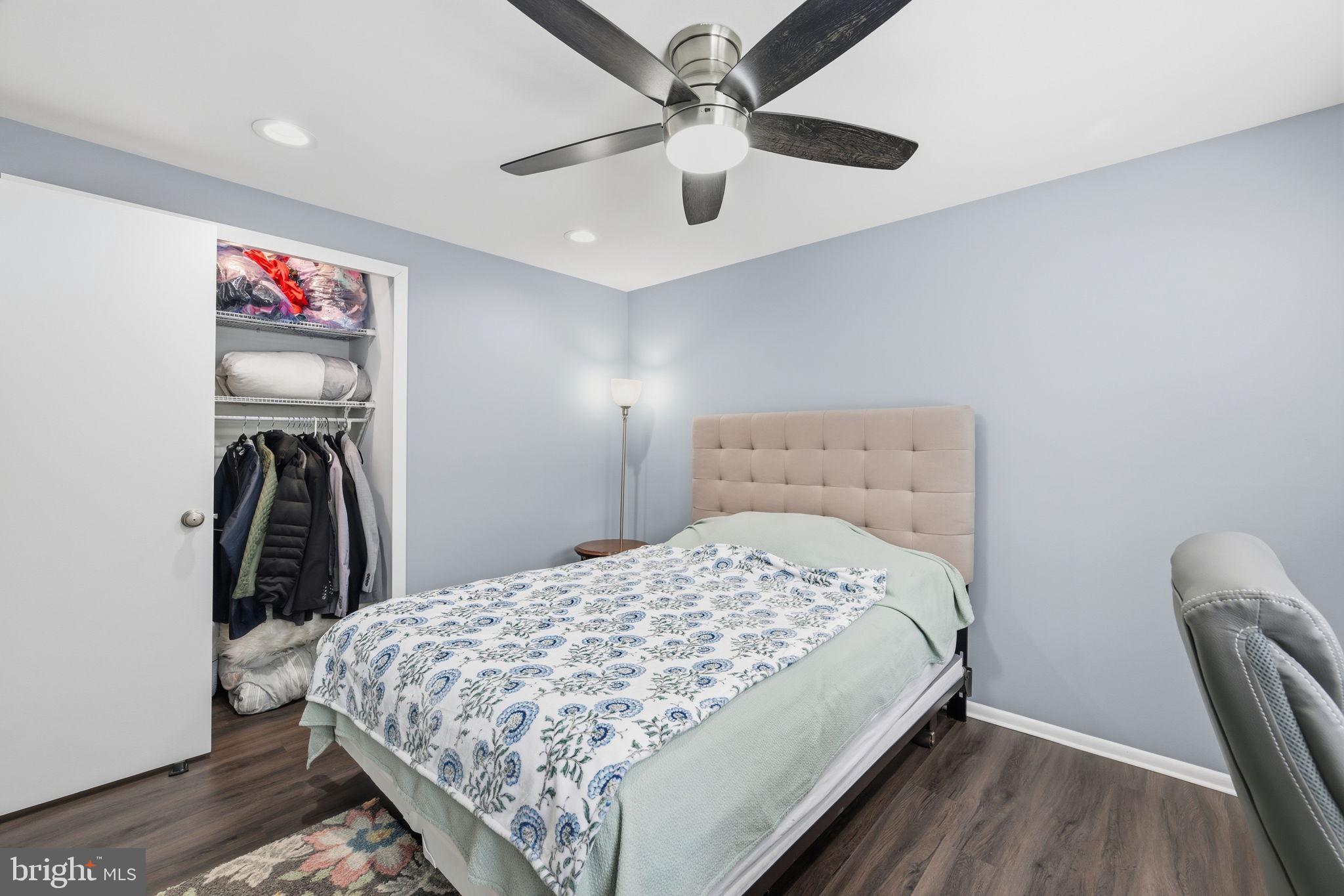 1708 Tarleton Way Crofton, MD 21114 - Photo 20 of 38 a bedroom with a bed and a chandelier