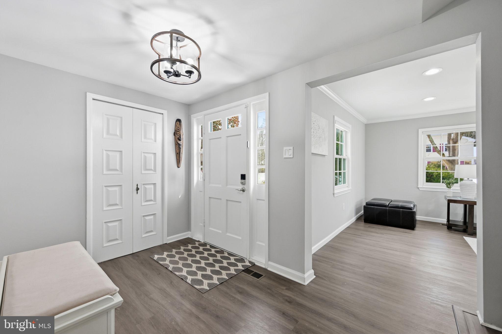 1708 Tarleton Way Crofton, MD 21114 - Photo 2 of 38 a view of livingroom with hardwood floor and white cabinet