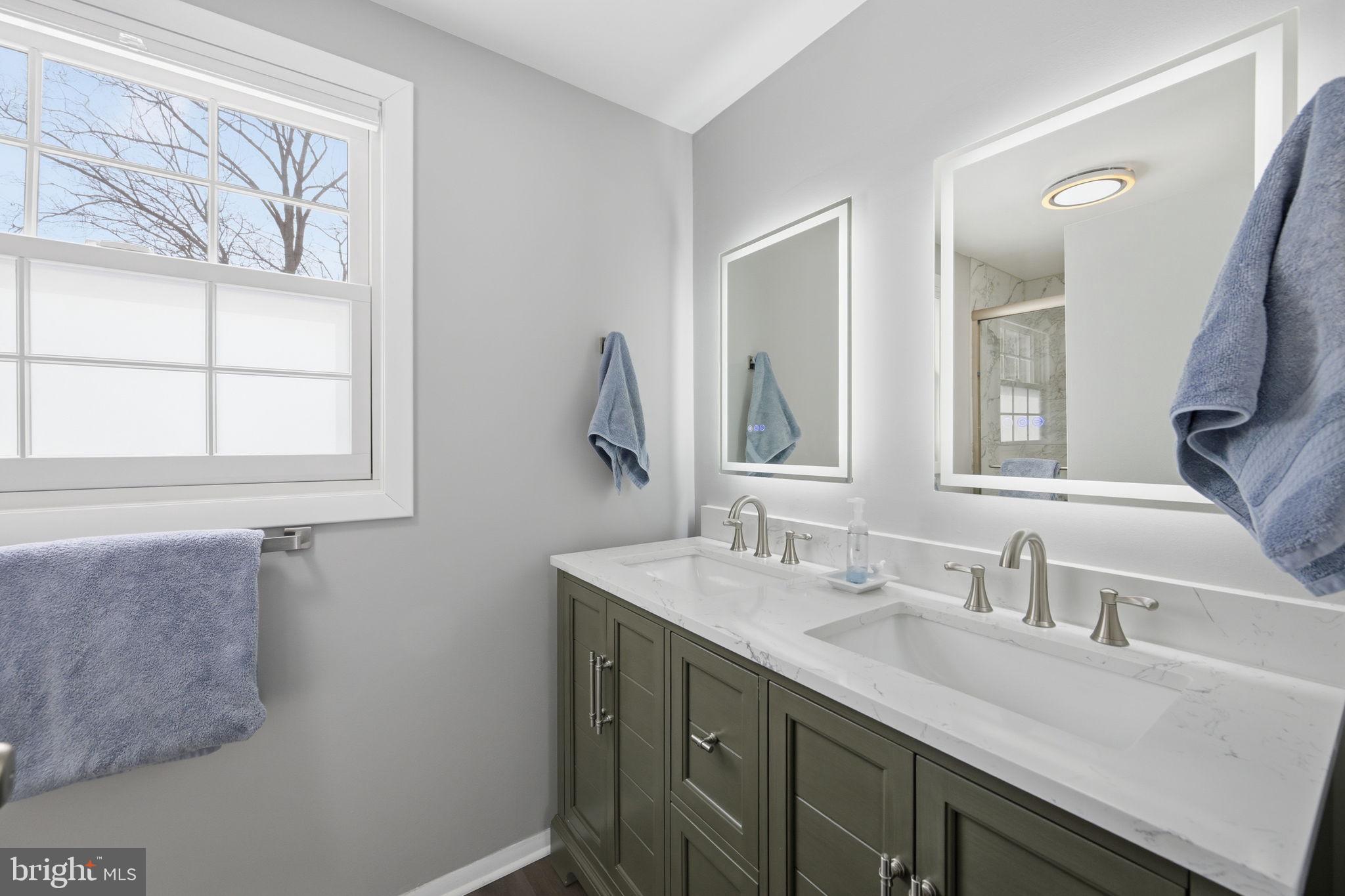 1708 Tarleton Way Crofton, MD 21114 - Photo 27 of 38 a bathroom with a sink and a mirror