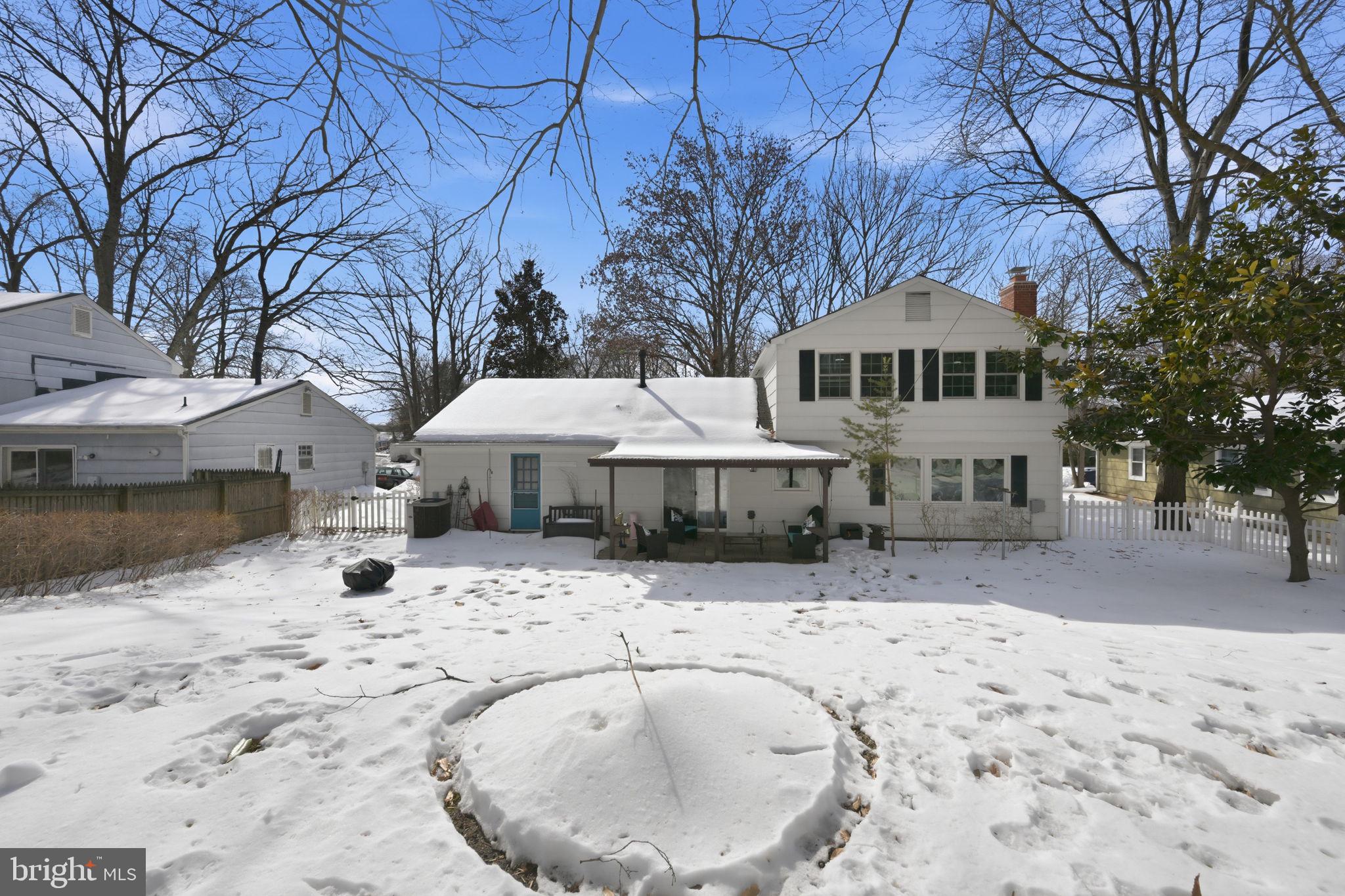 1708 Tarleton Way Crofton, MD 21114 - Photo 32 of 38 a front view of a house with a yard covered in snow
