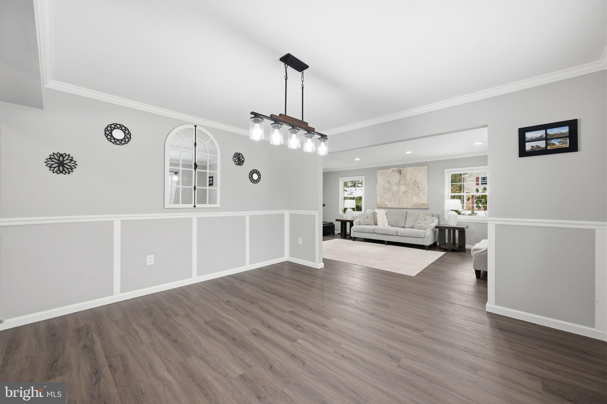 1708 Tarleton Way Crofton, MD 21114 - Photo 7 of 38 a view of a livingroom with wooden floor and stairs