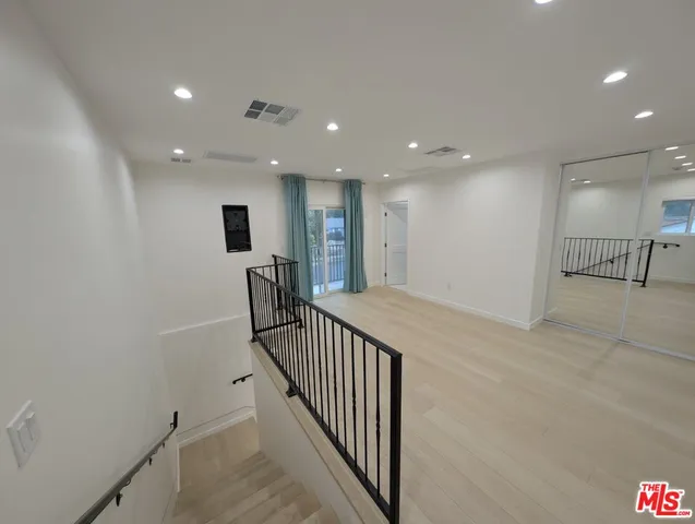 a view of a hallway with workspace