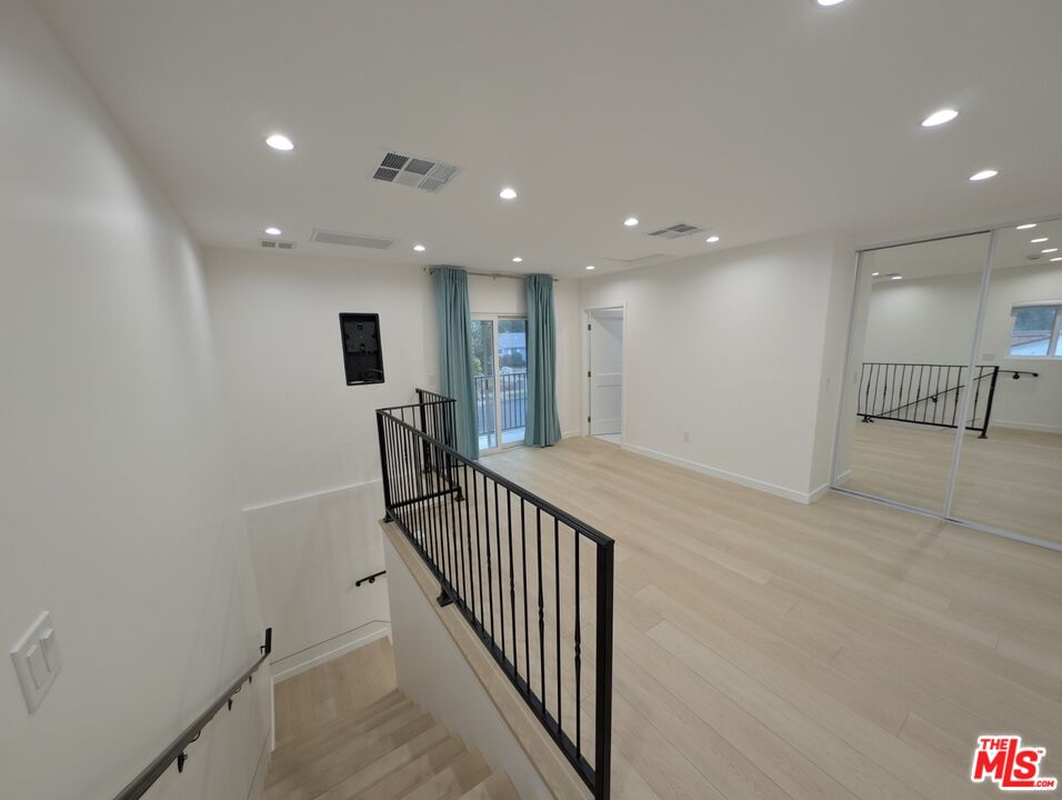 10623 Stanwin Avenue Mission Hills, CA 91345 - Photo 12 of 18 a view of a hallway with workspace