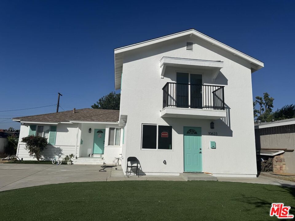 10623 Stanwin Avenue Mission Hills, CA 91345 - Photo 2 of 18 a front view of a house with a yard