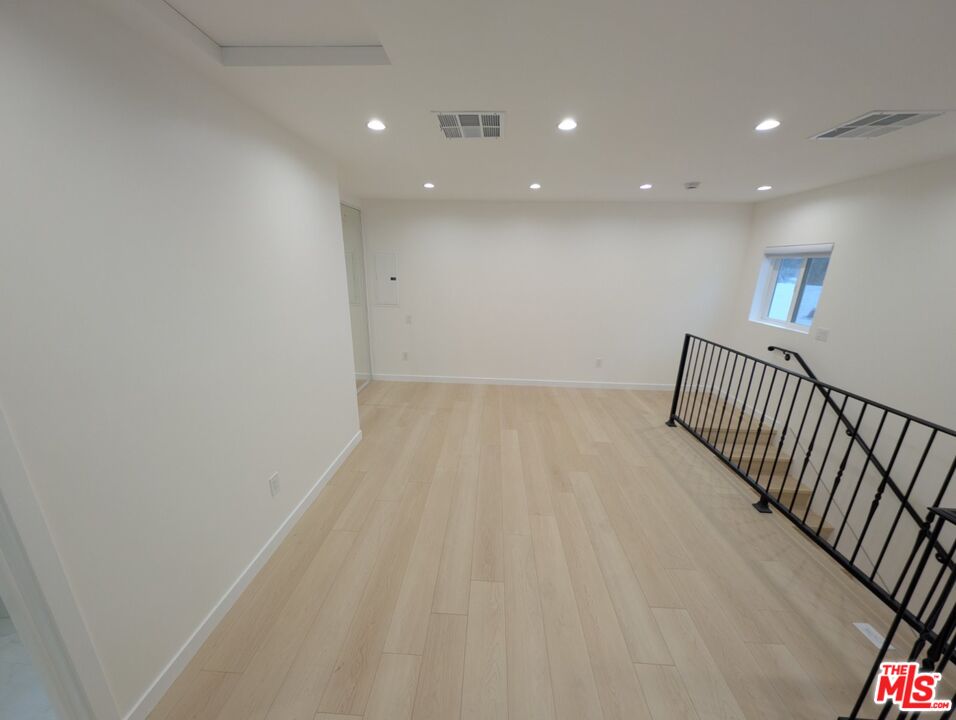 10623 Stanwin Avenue Mission Hills, CA 91345 - Photo 9 of 18 a view of hallway with stairs