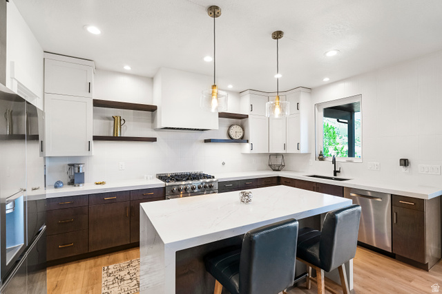 851 Grandview Drive Morgan, UT 84050 - Photo 7 of 68 Modern kitchen featuring a waterfall island with a white countertop