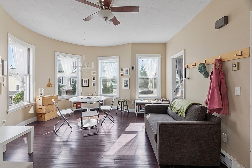 52 Providence Street, Unit 3 Worcester, MA 01604 - Photo 11 of 21 a living room with furniture and a large window