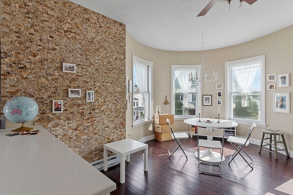 52 Providence Street, Unit 3 Worcester, MA 01604 - Photo 12 of 21 a living room with furniture and wooden floor