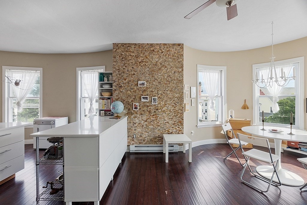 52 Providence Street, Unit 3 Worcester, MA 01604 - Photo 13 of 21 a living room with furniture and wooden floor