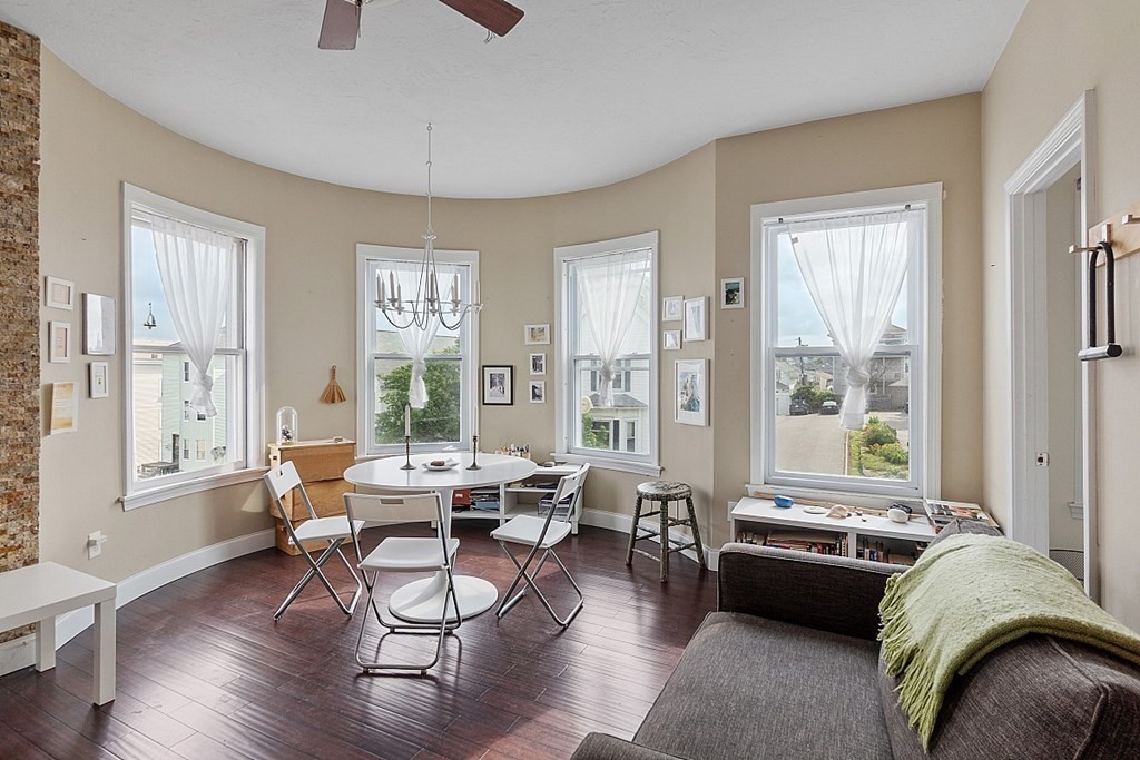 52 Providence Street, Unit 3 Worcester, MA 01604 - Photo 14 of 21 a living room with furniture and a large window