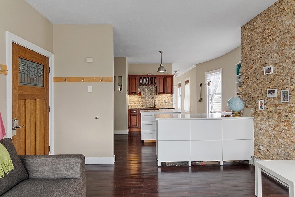 52 Providence Street, Unit 3 Worcester, MA 01604 - Photo 15 of 21 a living room with furniture and wooden floor