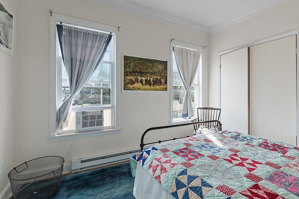 52 Providence Street, Unit 3 Worcester, MA 01604 - Photo 17 of 21 a bedroom with a bed and a window