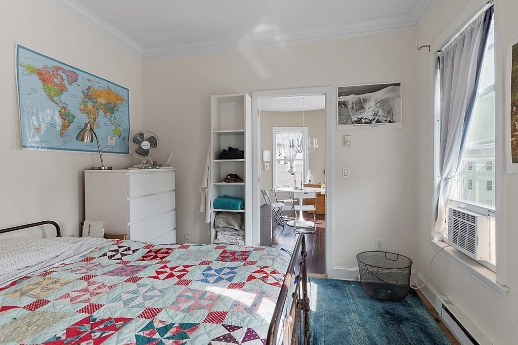 52 Providence Street, Unit 3 Worcester, MA 01604 - Photo 19 of 21 a bedroom with a bed and a window