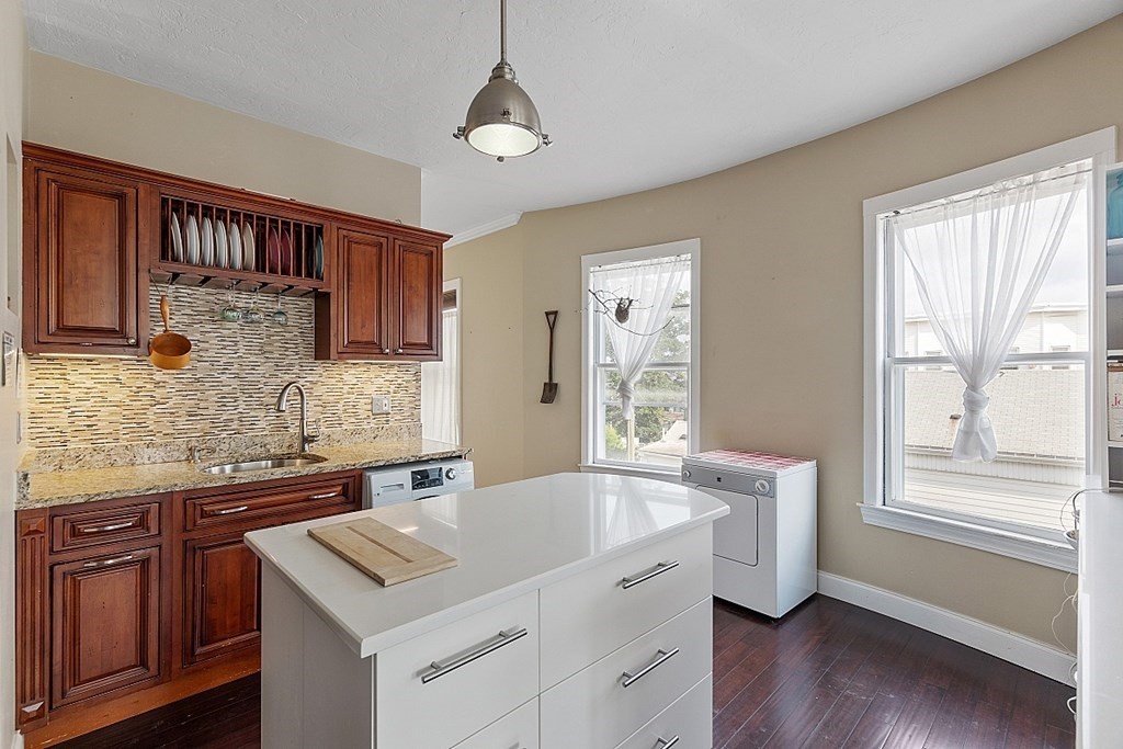 52 Providence Street, Unit 3 Worcester, MA 01604 - Photo 4 of 21 a kitchen with a sink stove and microwave