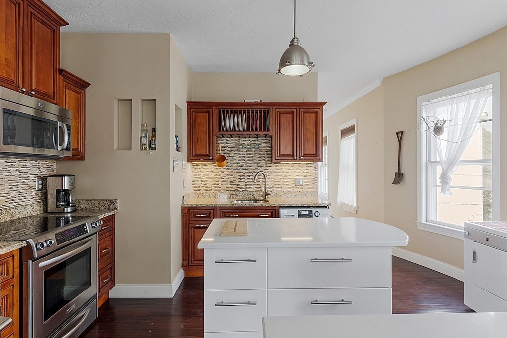 52 Providence Street, Unit 3 Worcester, MA 01604 - Photo 6 of 21 a kitchen with a sink stove and microwave