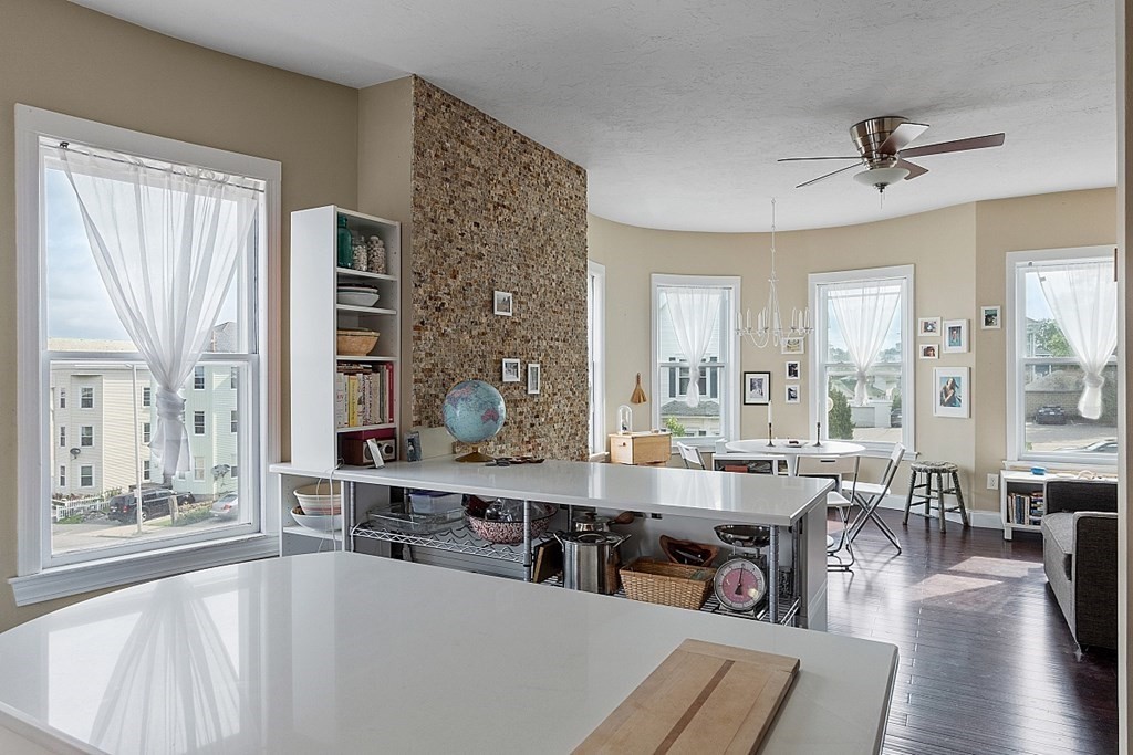 52 Providence Street, Unit 3 Worcester, MA 01604 - Photo 7 of 21 a large living room with a large window