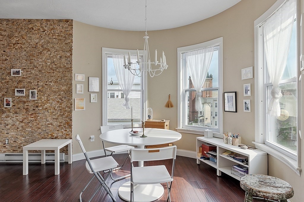 52 Providence Street, Unit 3 Worcester, MA 01604 - Photo 8 of 21 a living room with furniture and wooden floor