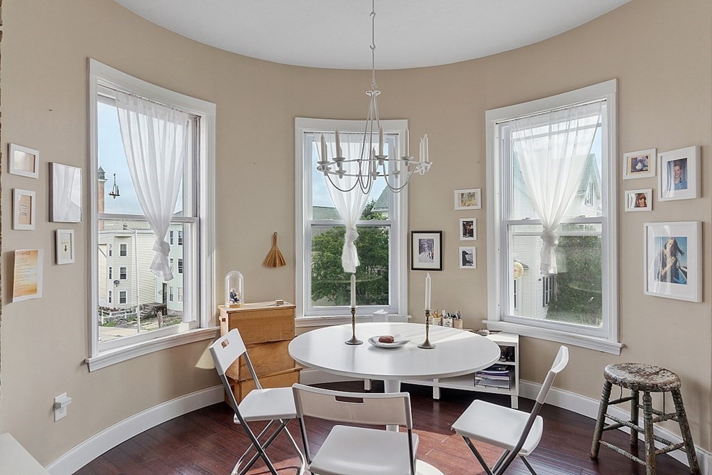 52 Providence Street, Unit 3 Worcester, MA 01604 - Photo 9 of 21 a view of a dining room with furniture and windows