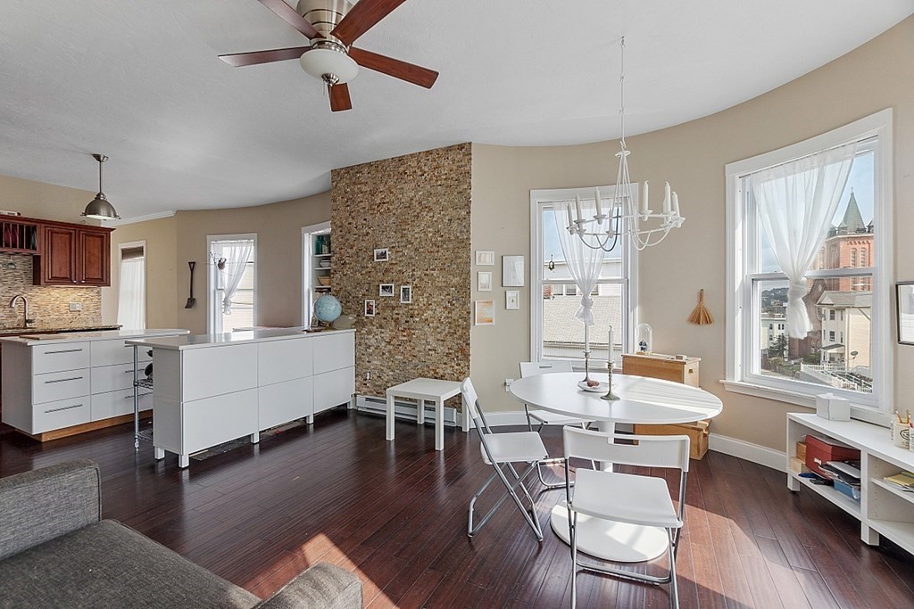 52 Providence Street, Unit 3 Worcester, MA 01604 - Photo 10 of 21 a living room with fireplace furniture and a wooden floor