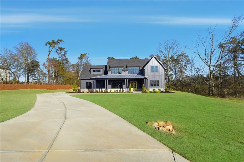 157 Palisade Drive Rydal, GA 30171 - Photo 2 of 68 a front view of house with yard and green space
