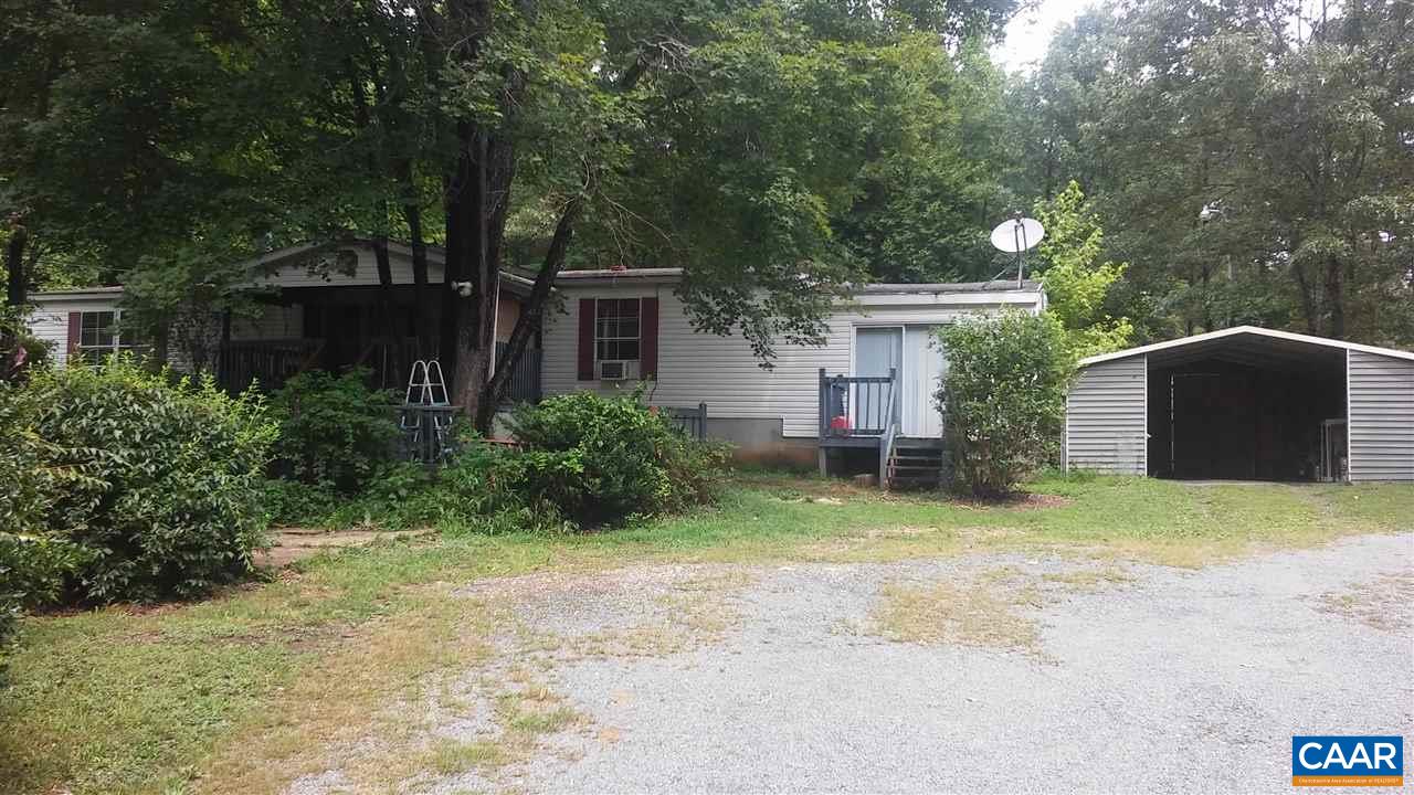 8988 Howardsville Road Howardsville, VA 24562 - Photo 2 of 12 a view of a house with a yard and large tree