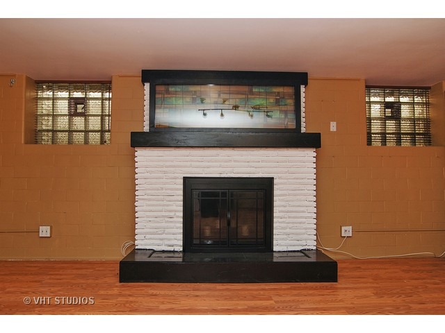 229 Blackhawk Road Riverside, IL 60546 - Photo 17 of 25 a living room with a fireplace
