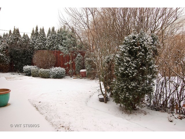 229 Blackhawk Road Riverside, IL 60546 - Photo 18 of 25 a view of a yard covered in snow