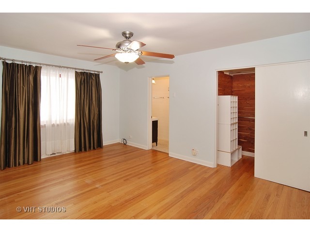 229 Blackhawk Road Riverside, IL 60546 - Photo 8 of 25 a view of an empty room with wooden floor