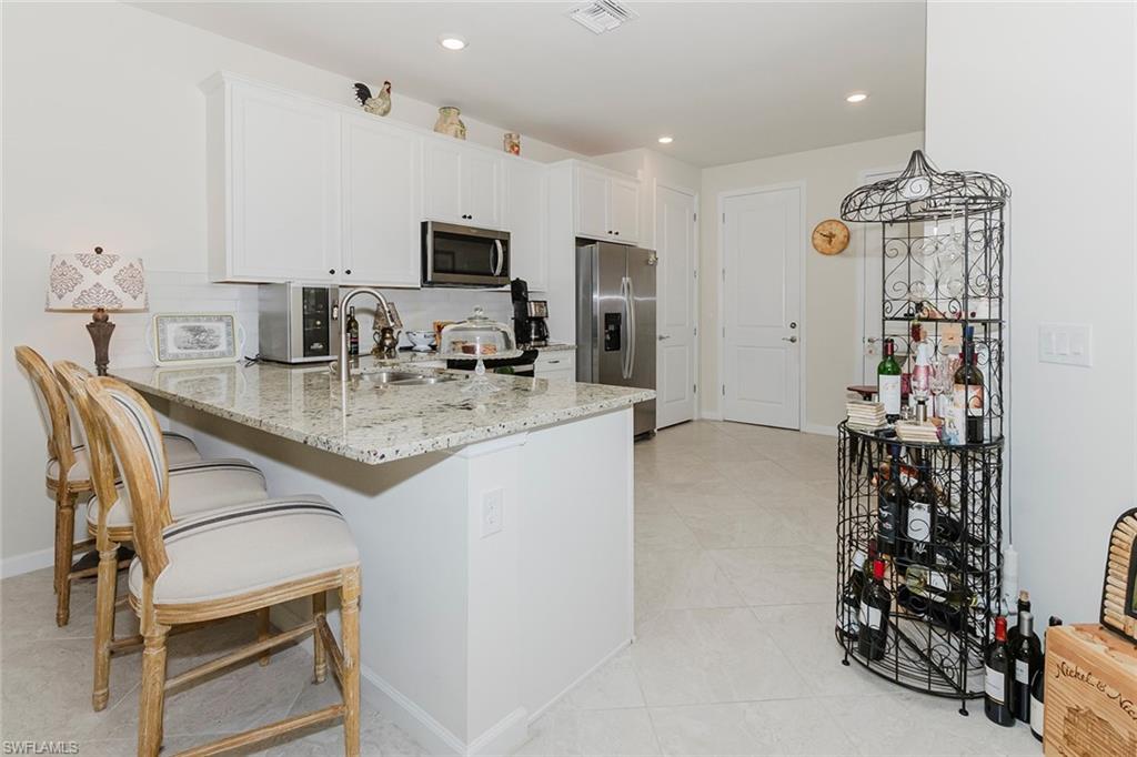 5948 Mayflower Way Ave Maria, FL 34142 - Photo 49 of 49 Open floorplan to kitchen and dining from foyer