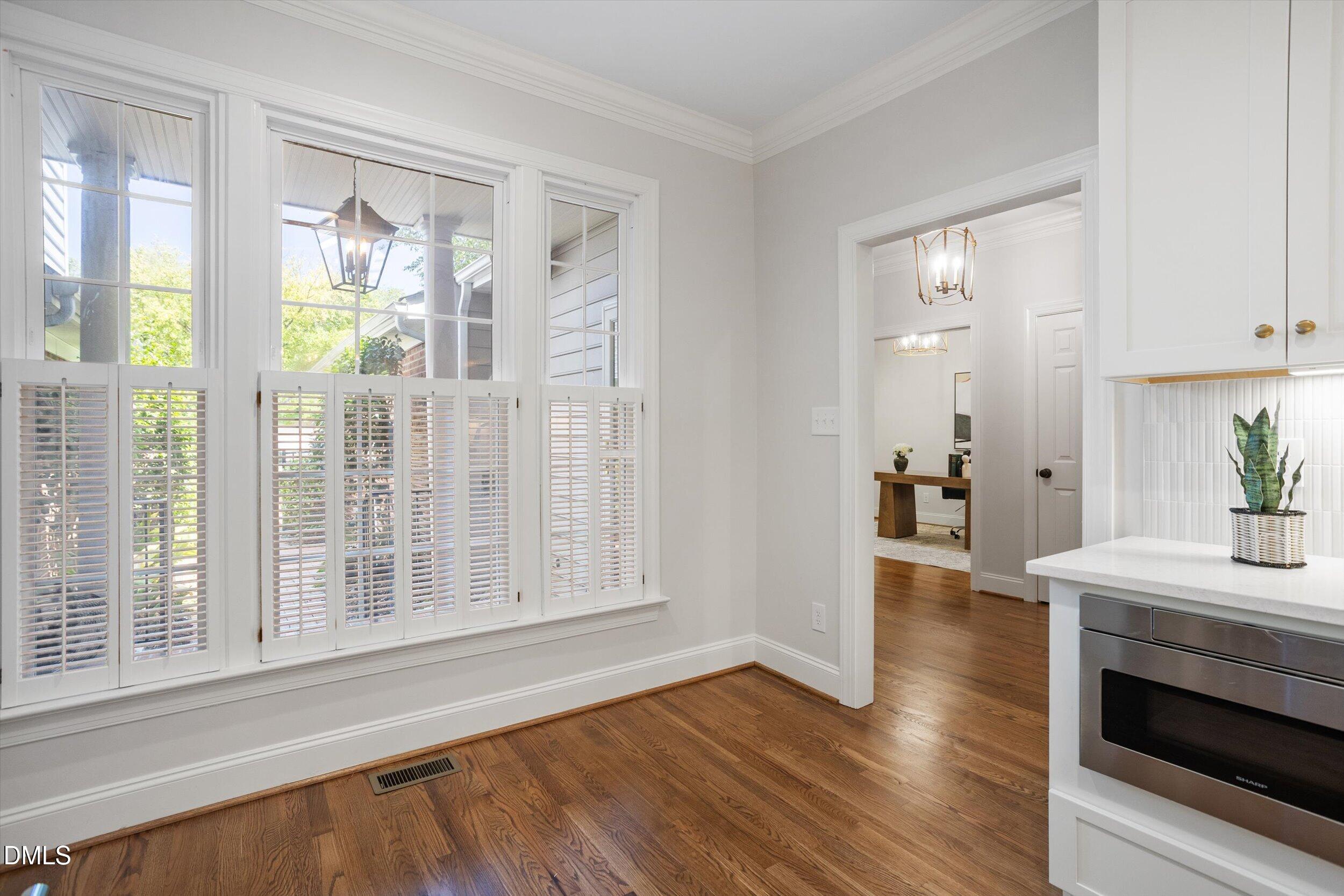 3417 Sir Colleton Court Raleigh, NC 27612 - Photo 14 of 46 Breakfast nook and shows built in microwave